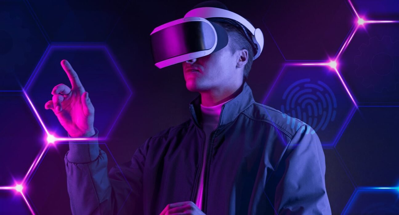 Person wearing a VR headset in a neon-lit hexagonal tech background, reaching forward.