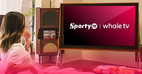 Woman relaxing on a couch in a cozy living room, watching a TV screen showing SportyTV and Whale TV logos.