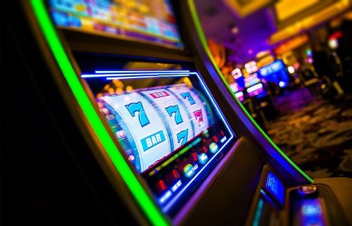Tilted slot machine in a casino with spinning reels showing sevens and BARs, neon lights glowing around it.