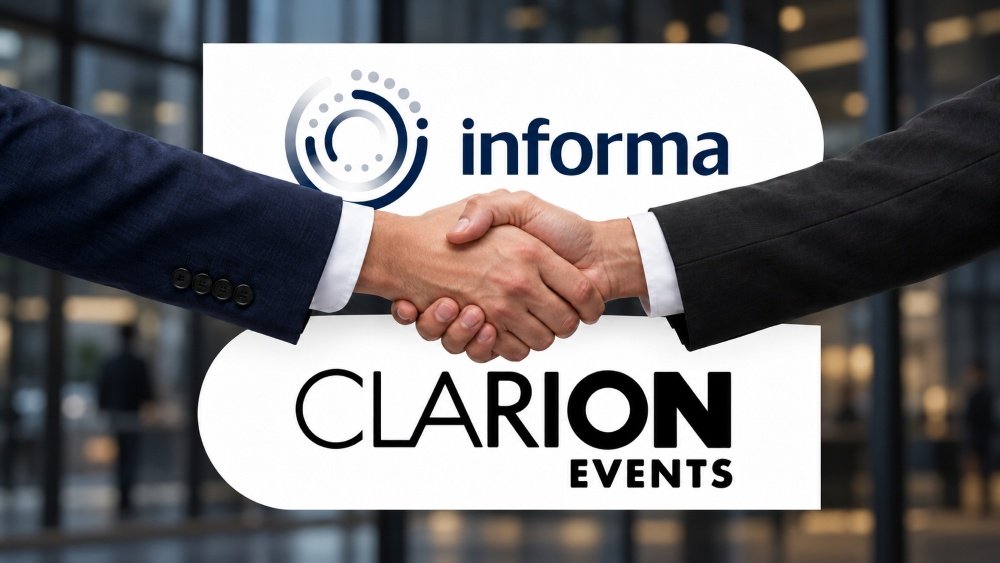 Handshake between two executives in front of a sign displaying Informa and Clarion Events branding, symbolizing a partnership.